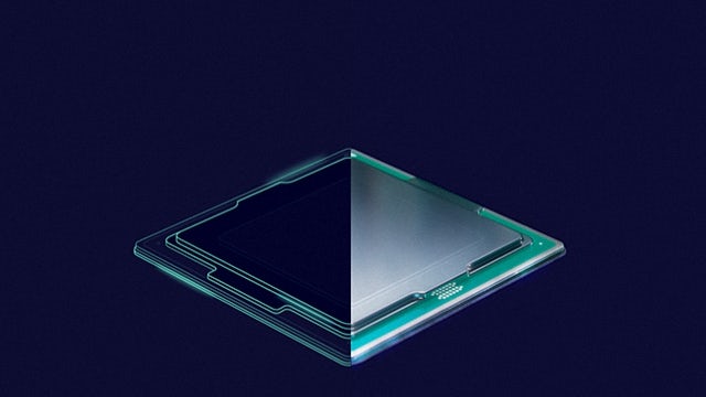 Hand in latex gloves holding a 3D IC chip