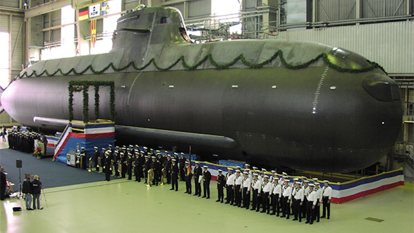This shows the dividing line between where composites (top) and metal (the hull) have been used on this class 214 submarine. HDW is using Fibersim to design and manufacture the complete upper deck, keel covers, tower sail fairings, propeller blades and rudders.