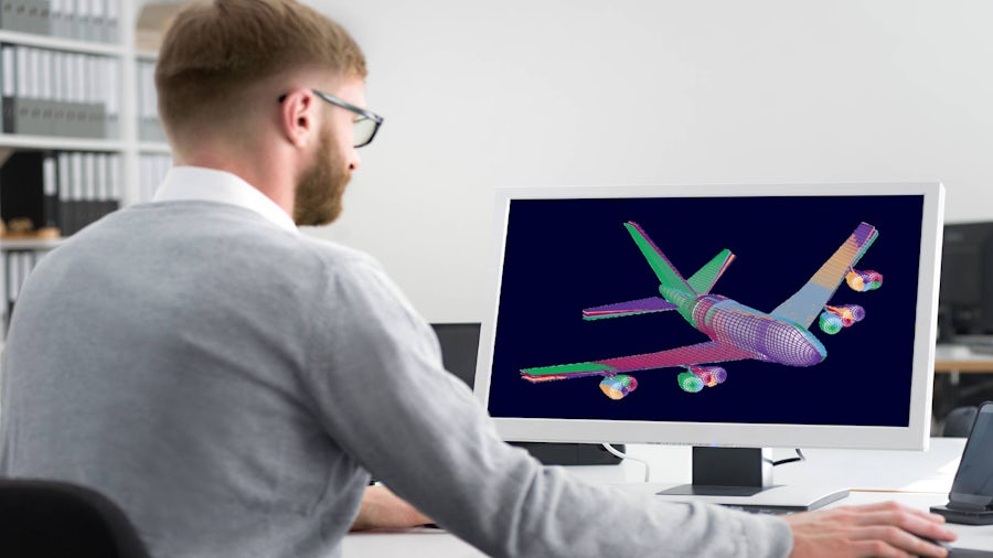 engineer analyzing digital twin of aircraft on a desktop computer.