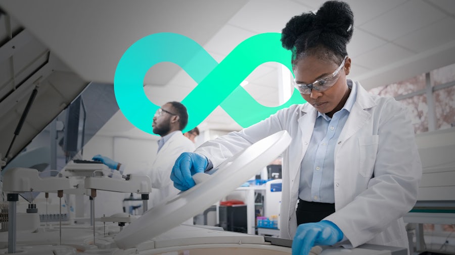 A female scientist in a laboratory with a Siemens graphic in the backgroud.