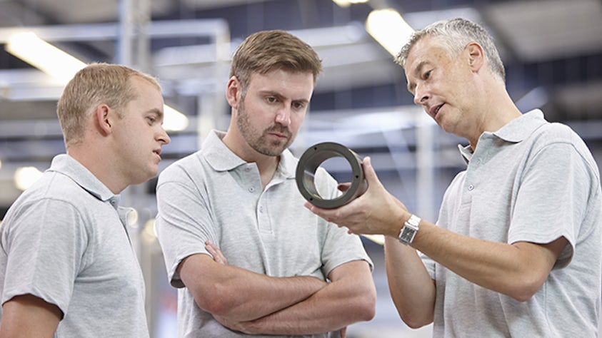 A group of coworkers conducting a supplier assessment.