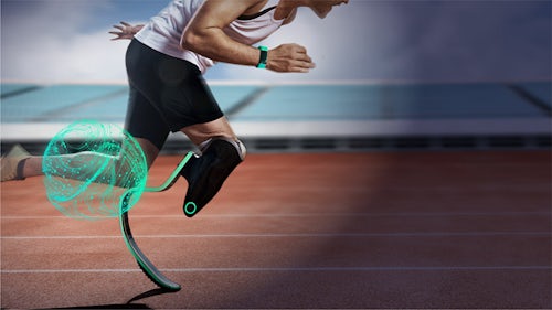 Image of male athlete running on track with prosthetic leg 