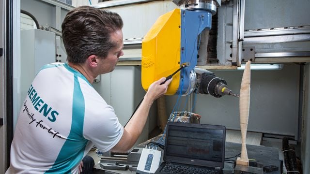 Engineer operating vibration troubleshooting.