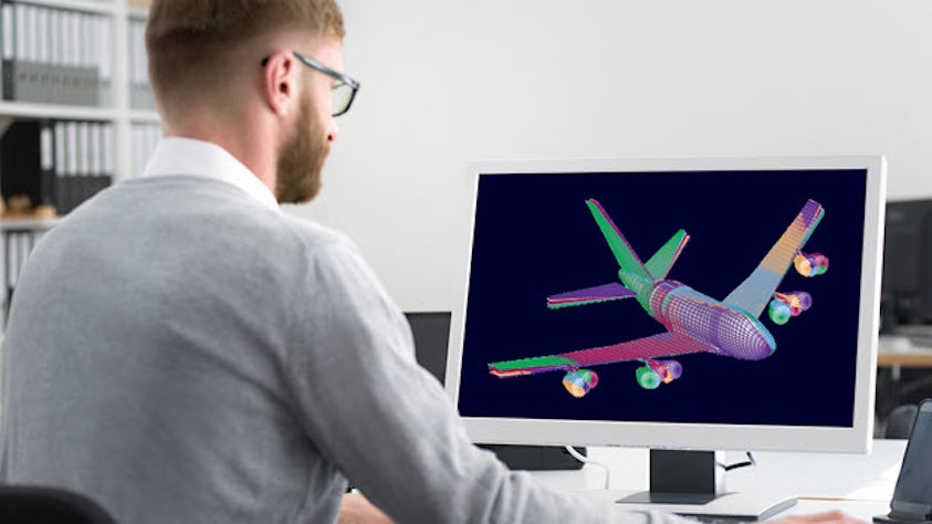 Engineer reviewing aeroelastic behavior of an airliner from simulation with Simcenter Zona