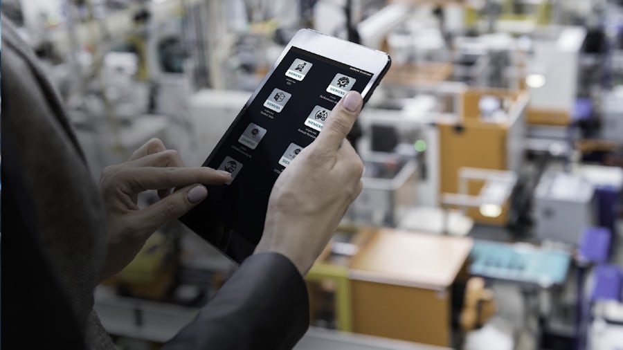 Person holding a table in a factory