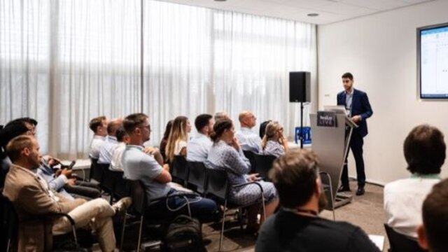 Attendees sitting in a breakout session at Realize LIVE Europe.