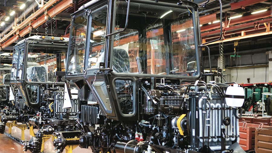An operator checking the display of production line