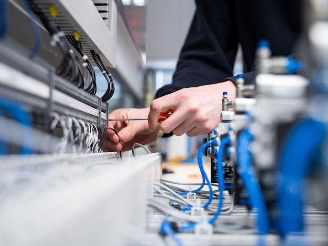 Connecting a computer interface using a screwdriver.
