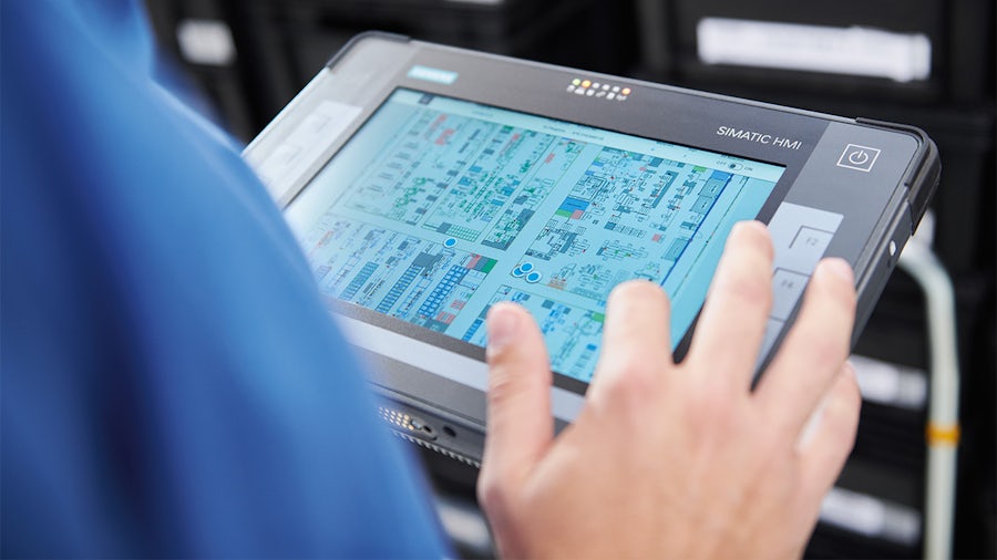 Worker using an industrial tablet.