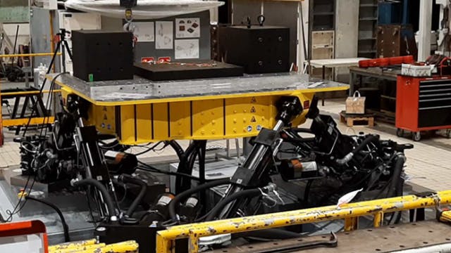 Shop floor with an elevated platform before the component being worked on is placed on the platform. 