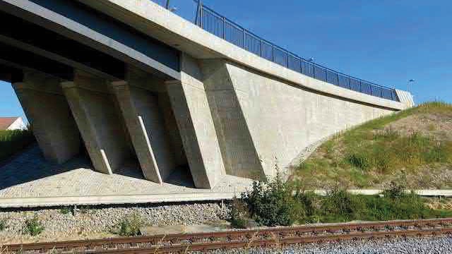 Many bridges such as this road bridge crossing a railroad line at Großharthau in eastern Germany feature super-elevated curves and changing gradients.