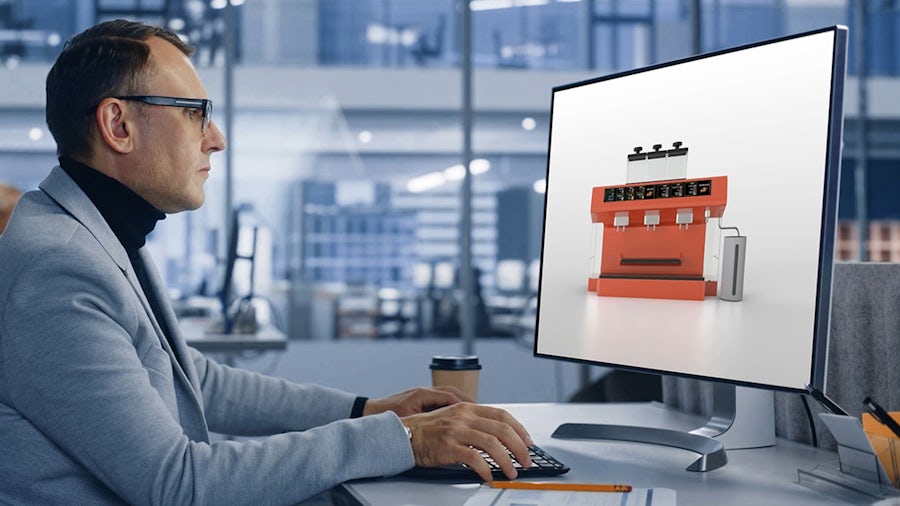 man on computer with coffee machine on screen 