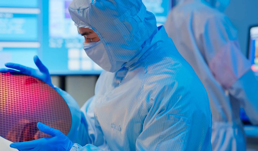 Two men working at a lab in lab attire