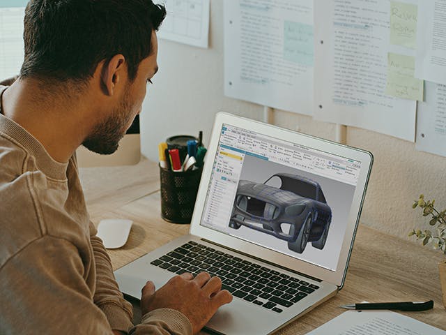 Person using NX X Design Premium to create a complex automotive design.