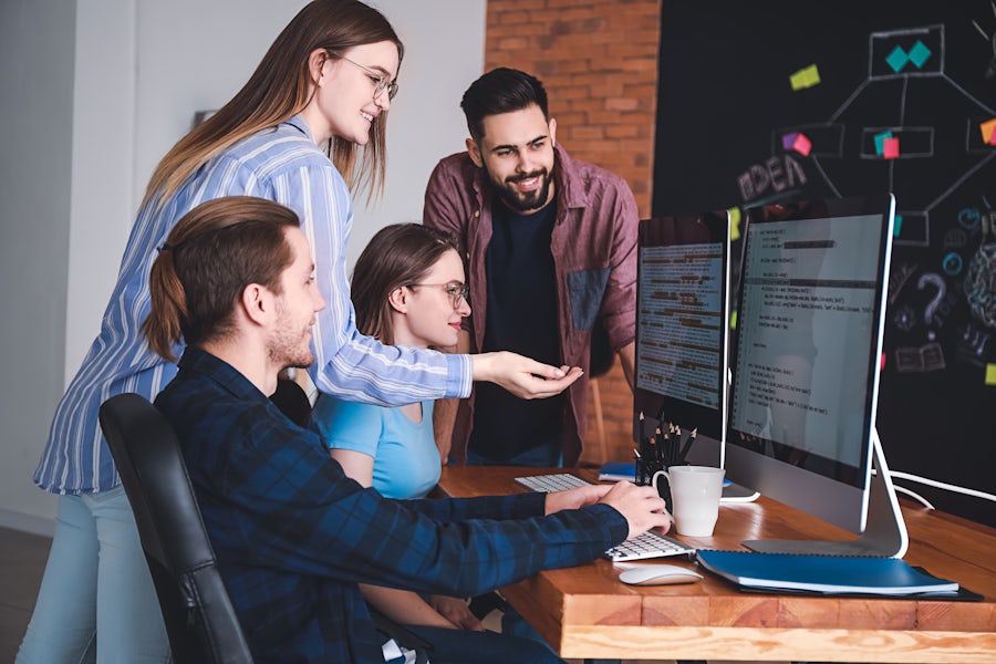 IT team collaborating together in the office.