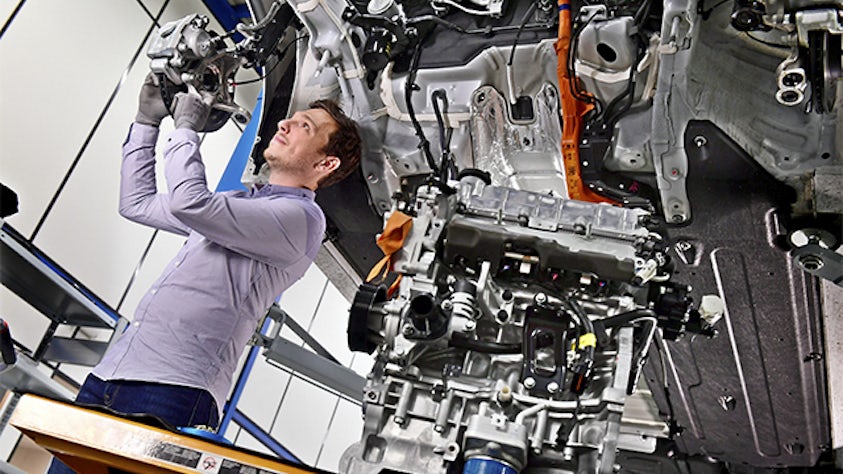 An expert engineer running a test on a vehicle in our testing facilities.