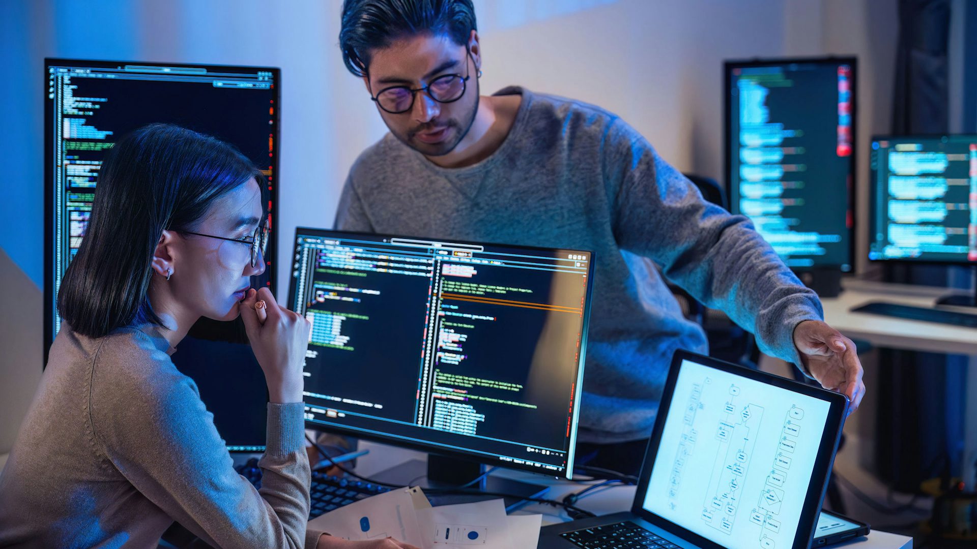 Two engineers debugging software.