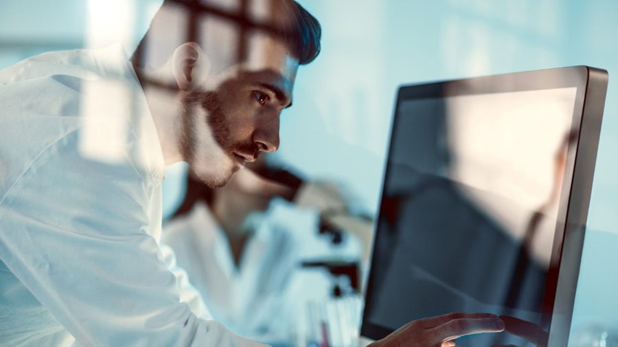 Scientist uses modern touchscreen technology for research.