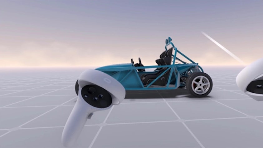 An erod vehicle design in the NX Immersive Explorer environment. There are two hand controllers shown on the screen pointing at the design.