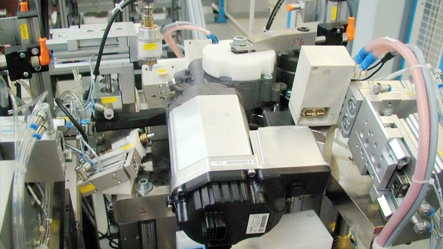 Automated testing of an electric motor for defects at the end of a production line.