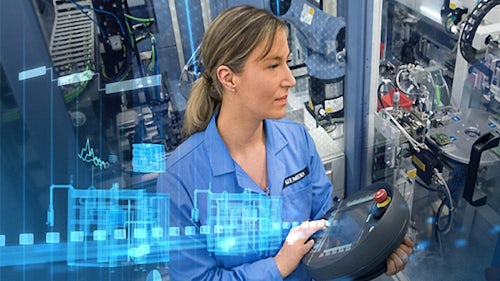 An engineer uses digital twin software to inspect an industrial machine in operation.