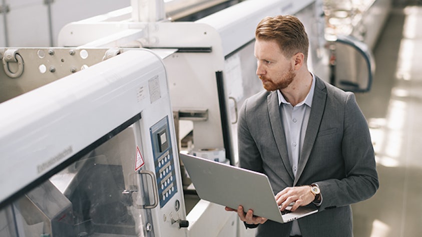 An employee looking at discrete manufacturing.