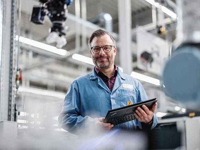 Engineer holding a tablet. 