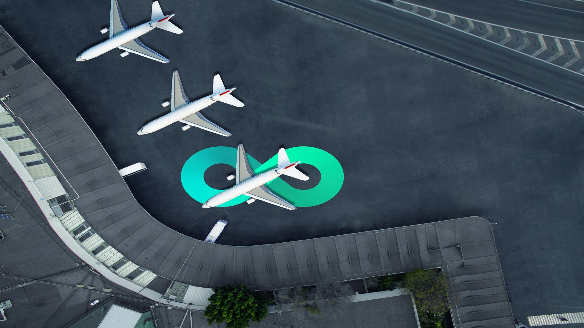 Multiple airplanes are shown parked at an airport from overhead. An infinity symbol sits underneath one of the planes, representing digital transformation.