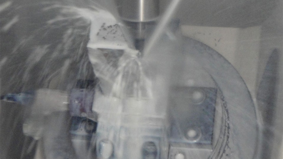 A Heiwa Sangyo machine being sprayed with water