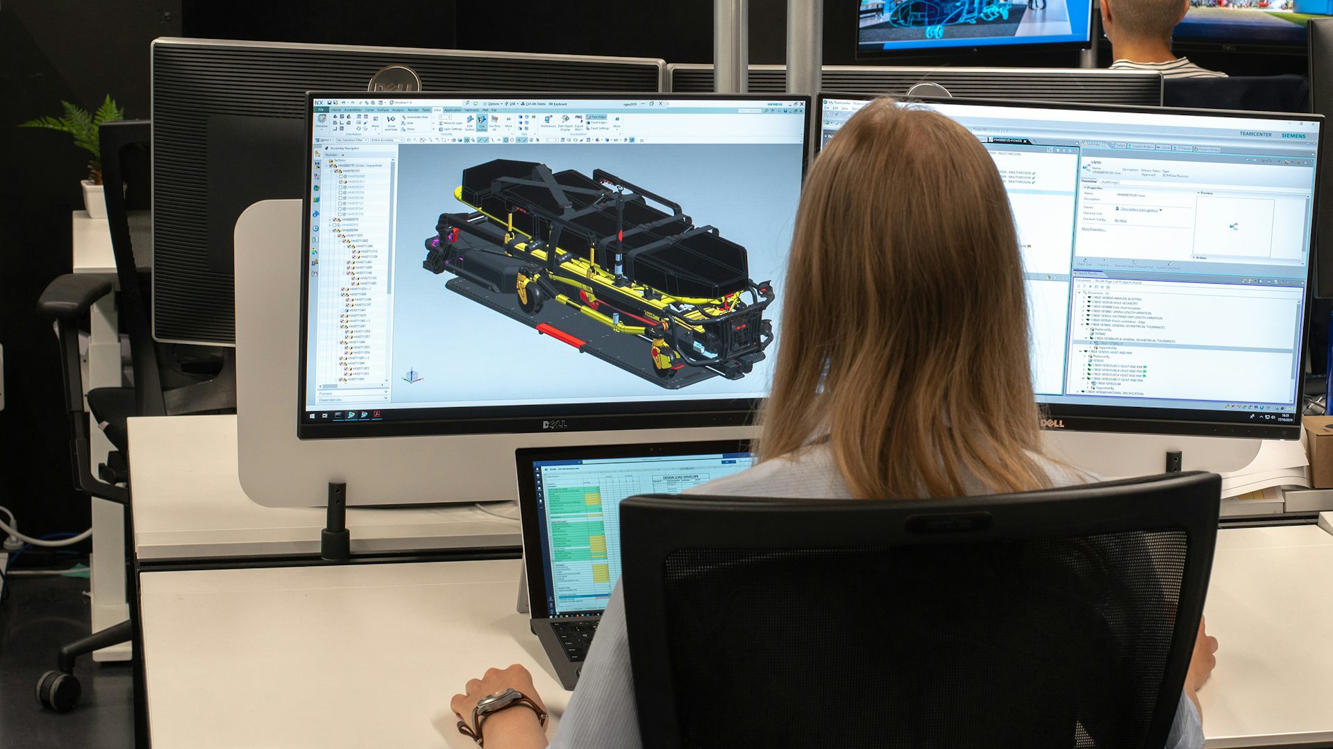 An engineer designs a 3D model of a gurney using a computer-aided design system. The 3D assembly is modeled using D-Cubed component software. 