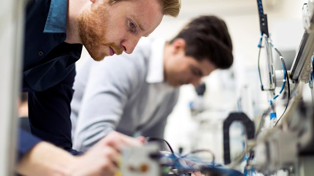Engineers debugging an integrated circuit.
