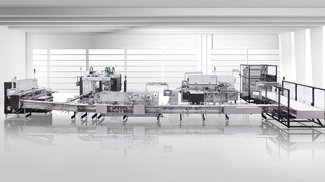 Packaging system with high-performance flow and fold wrapping machines for chocolate bars.