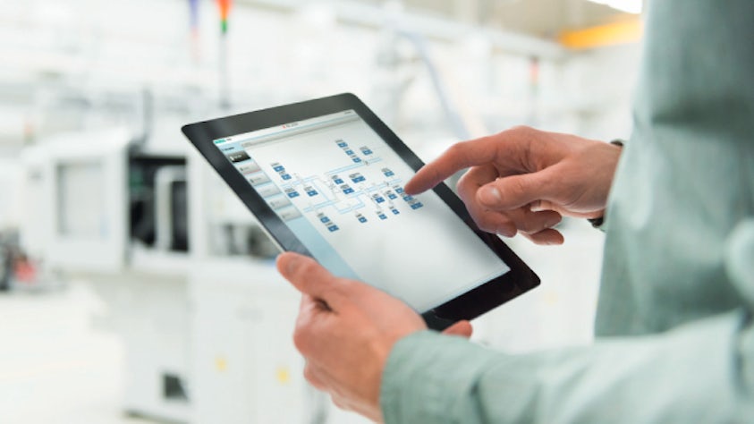 A person taps buttons on a tablet computer.