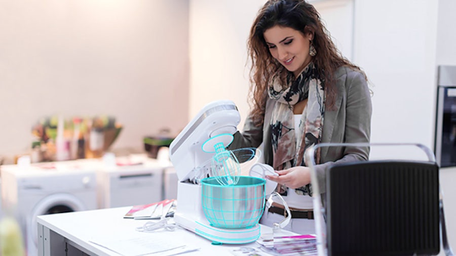 Woman with a stand mixer.
