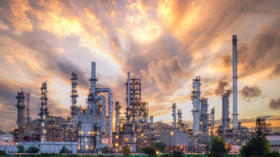 The refinery is an industrial area with sunrise and cloudy skies, oil and natural gas storage tanks, the refinery industry. 