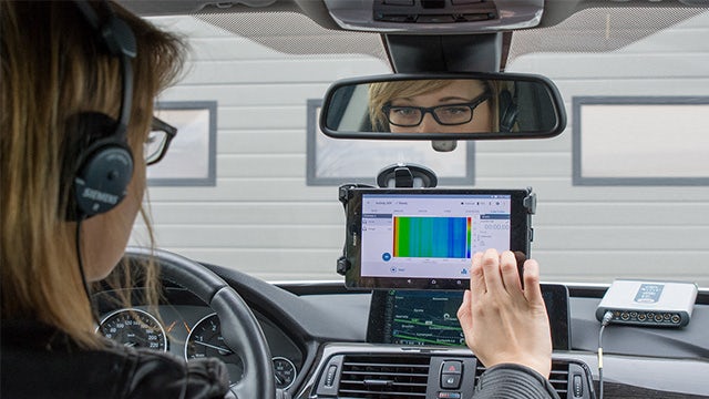 A driver using the Simcenter physical testing solution.