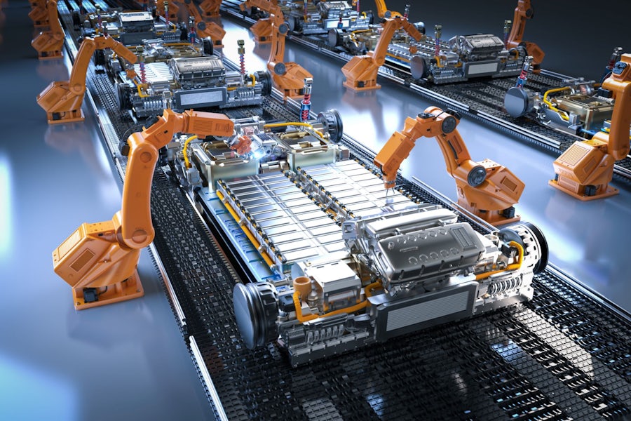a group of battery manufacturing machines working on a conveyor belt of batteries.