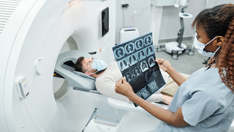 Girl looking at MRI films