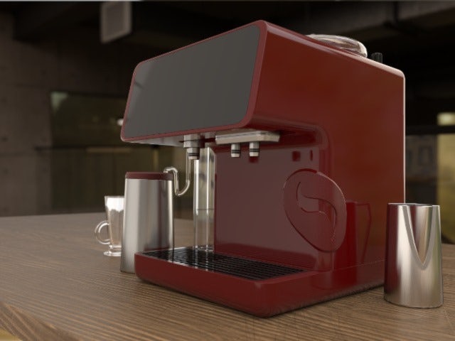 A coffee-making machine on the desk.