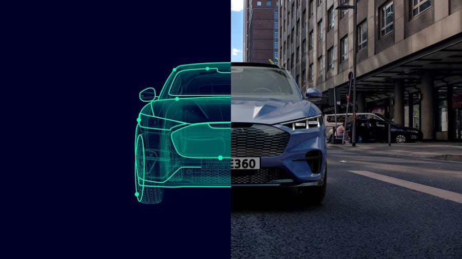 The front of a Ford with half of the image showing the digital twin