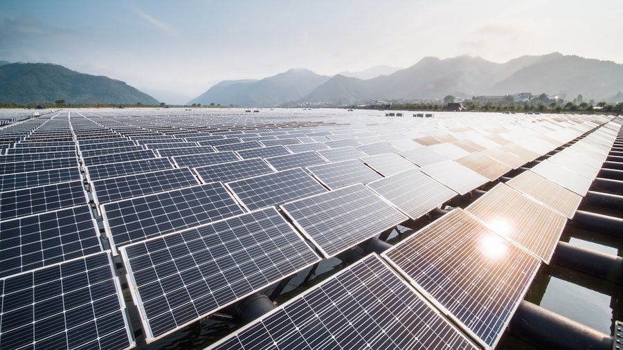 Solar farm surrounded by mountains