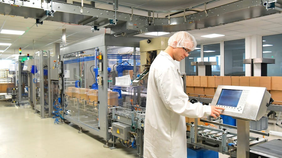 An engineer on the production link in a medical device manufacturing facility.
