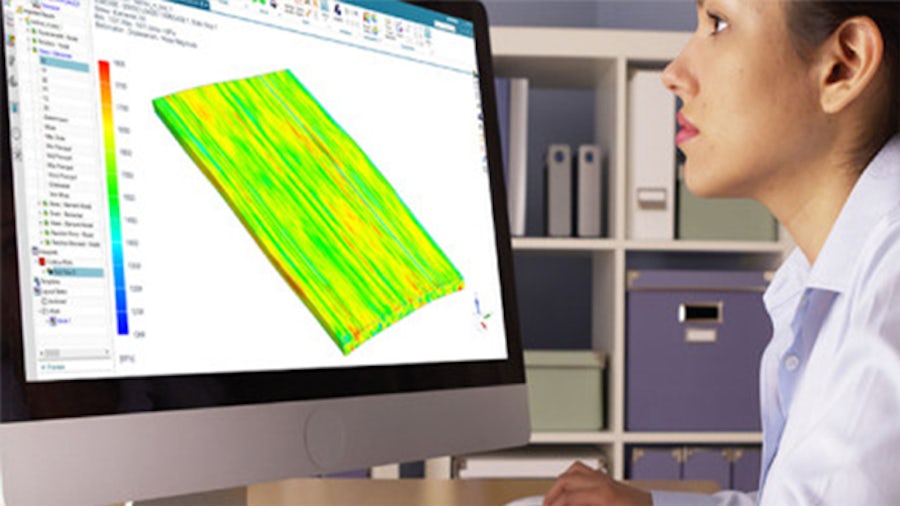 A woman reviewing multiscale simulation on a computer screen