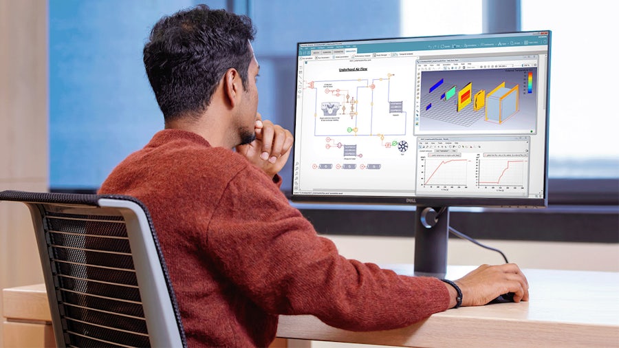 A man at the desktop using the Simcenter systems simulation.