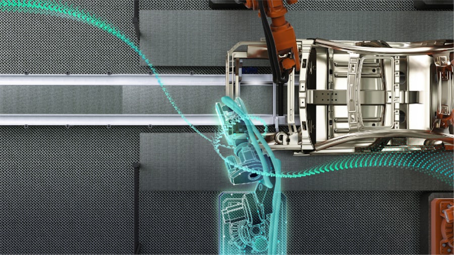 Una fabbrica del futuro per la produzione automobilistica che fonde mondo virtuale e mondo fisico attraverso la tecnologia del digital twin.