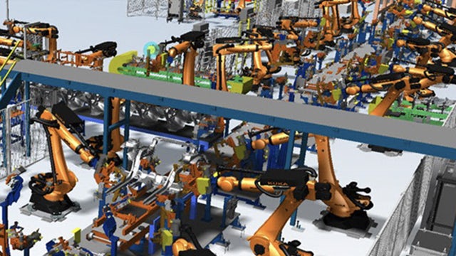 Many robots working on a line in a factory.