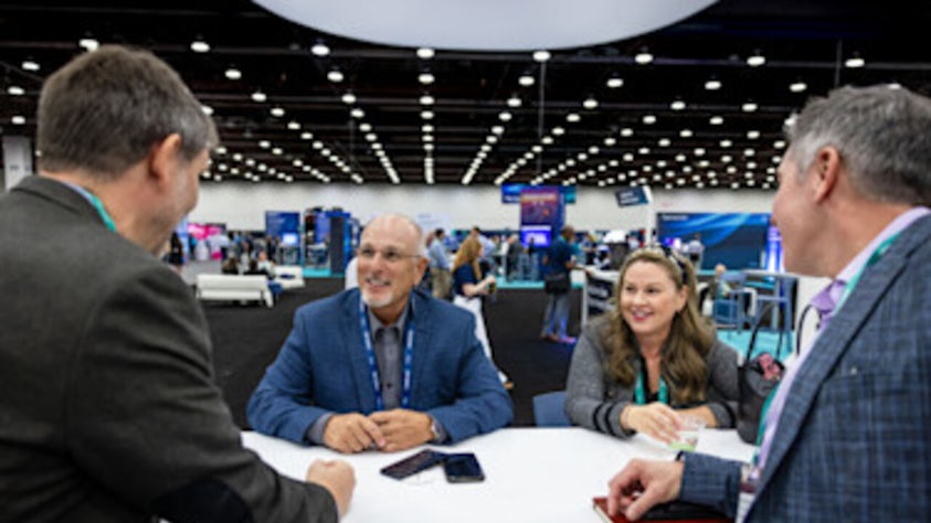 Realize LIVE Attendee at a booth in the Solutions Center.