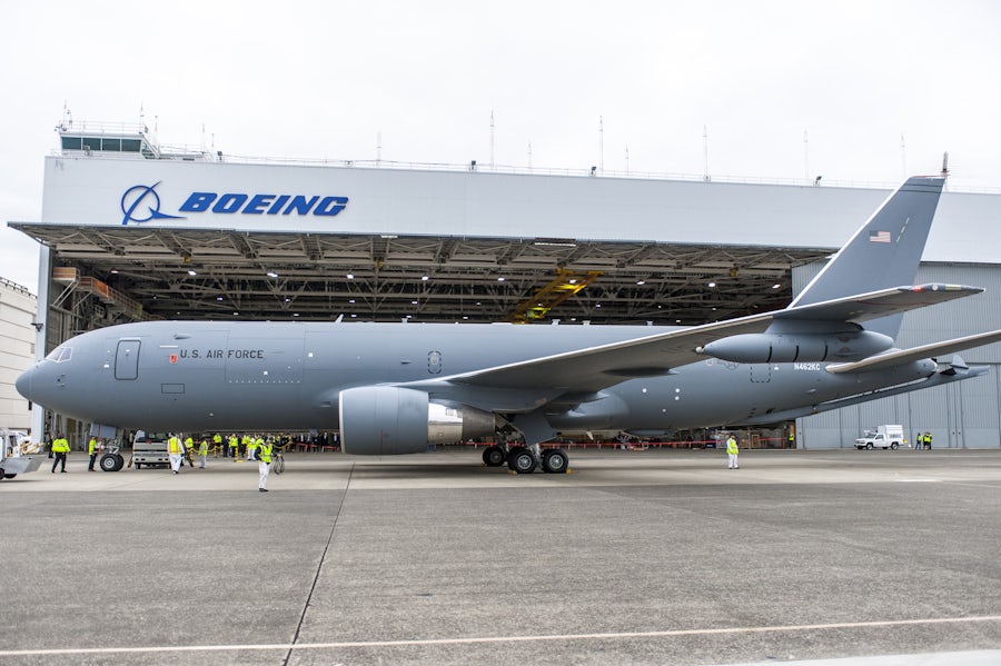 Image of an airplane near a Boeing building