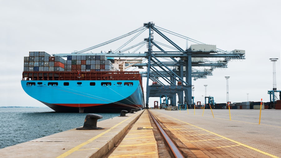 Loaded container ship in a container port. 