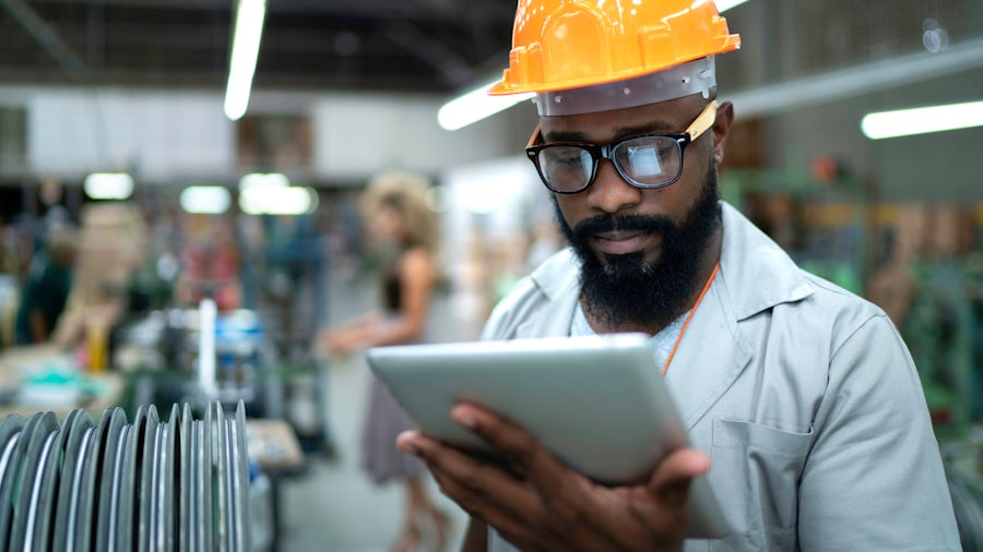 Heavy equipment design engineer in a manufacturing setting